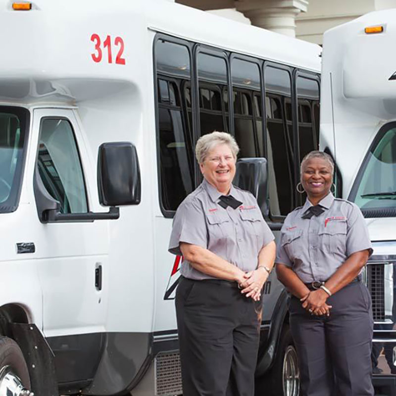 Anchor Employees Standing Outside of Minibus